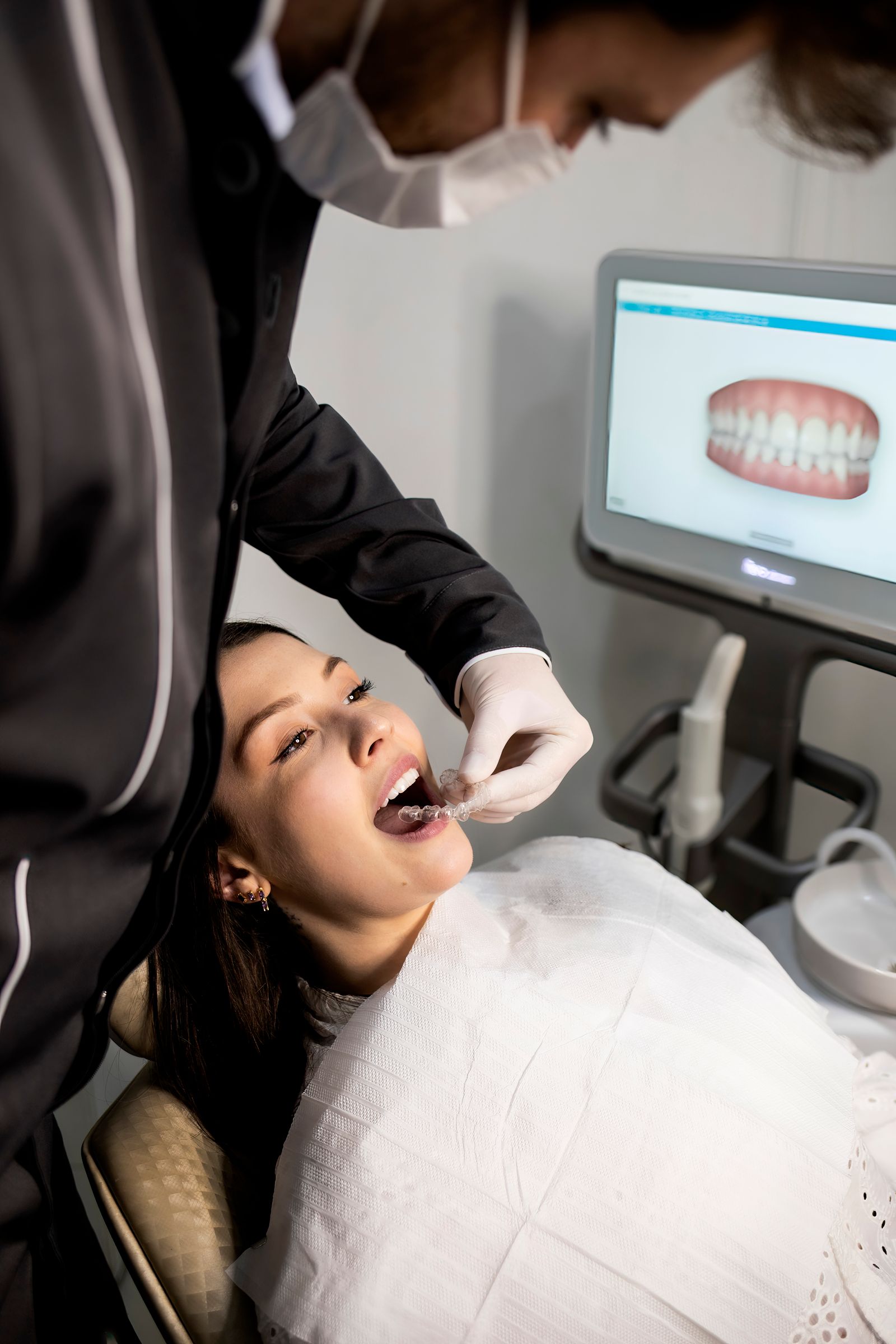 A consultation between a dental professional and a patient